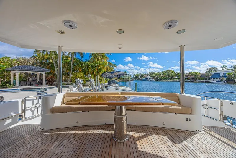Slide: The Image of Luxurious 2010 Ocean Alexander 74 Motoryacht deck with scenic waterfront view. - 22