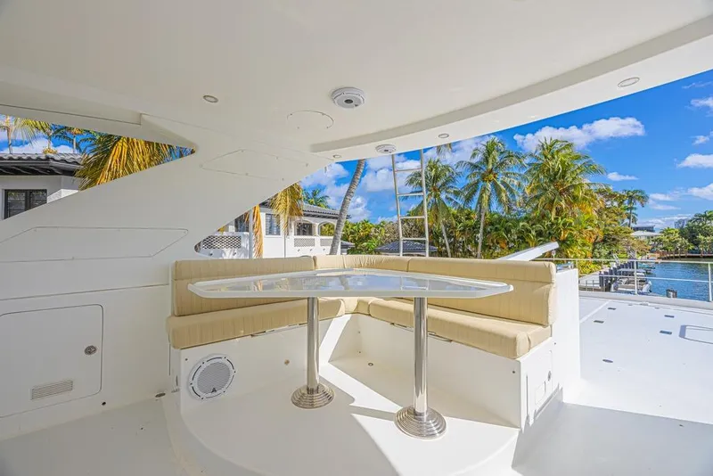 Slide: The Image of Outdoor seating area on 2010 Ocean Alexander 74 Motoryacht, with tropical view. - 19