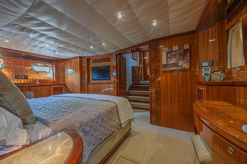 Slide: The Image of Luxurious bedroom interior of 2010 Ocean Alexander 74 Motoryacht with wood paneling and modern amenities. - 51