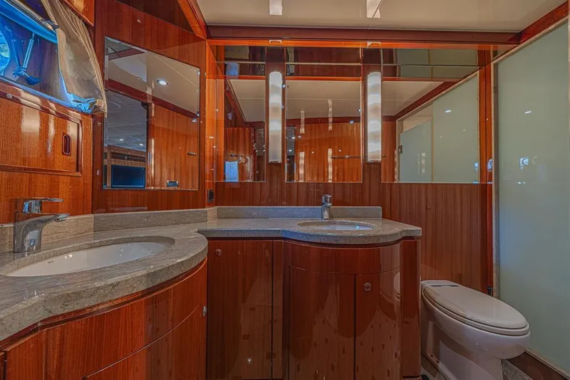 Slide: The Image of Luxurious bathroom in 2010 Ocean Alexander 74 Motoryacht with wood accents and modern fixtures. - 52