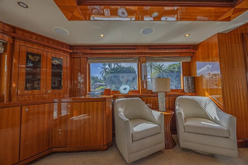 Slide: The Image of Luxurious interior of 2010 Ocean Alexander 74 Motoryacht with elegant wood paneling and plush seating. - 28