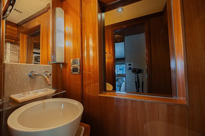 Slide: The Image of Luxurious bathroom interior of 2010 Ocean Alexander 74 Motoryacht with elegant wood finish. - 53