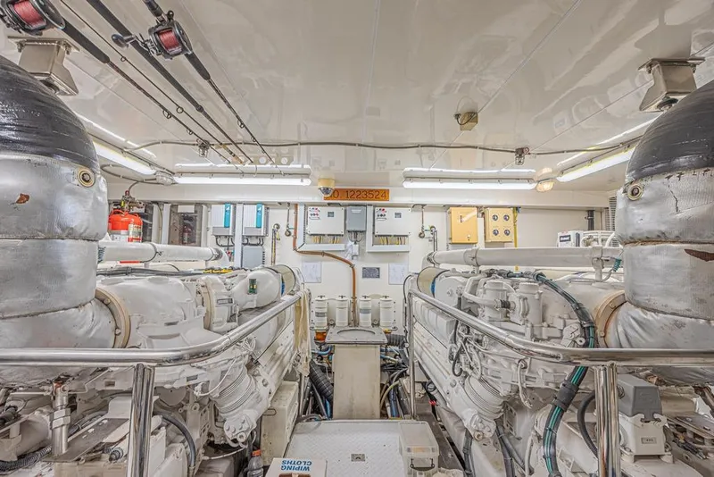 Slide: The Image of Engine room of 2010 Ocean Alexander 74 Motoryacht, featuring dual engines and control systems. - 55