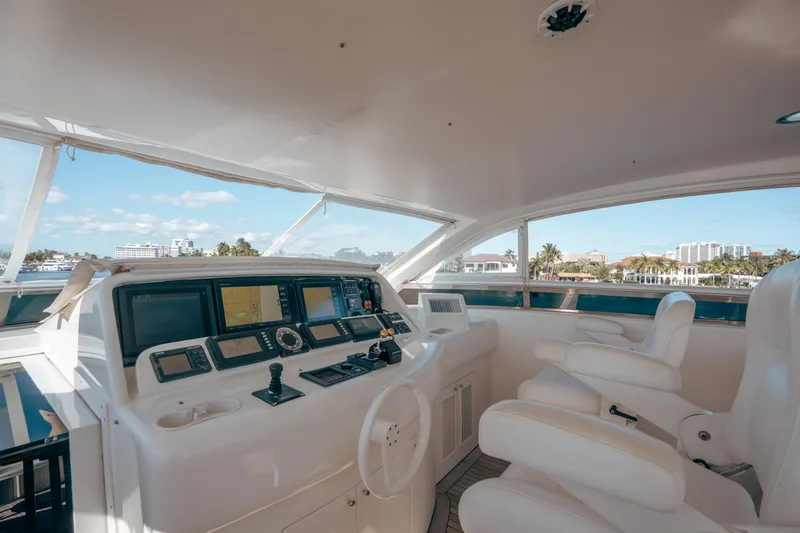 Slide: The Image of Luxurious 2004 Lazzara 106 yacht cockpit with modern navigation equipment and plush seating. - 21