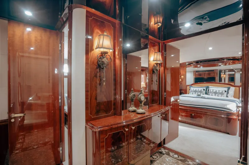 Slide: The Image of Luxurious interior of 2004 Lazzara 106 yacht with elegant wood finishes and plush bedding. - 54