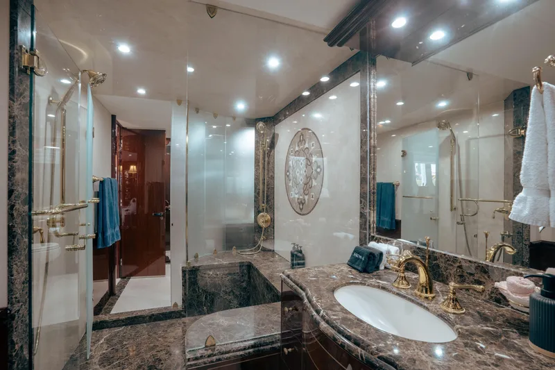 Slide: The Image of Luxurious marble bathroom on 2004 Lazzara 106 yacht with elegant gold fixtures and modern lighting. - 55