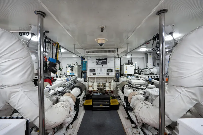 Slide: The Image of Engine room of 2004 Lazzara 106 yacht, featuring advanced machinery and equipment. - 70