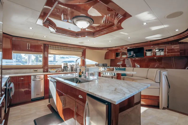 Slide: The Image of Luxurious interior of 2004 Lazzara 106 yacht with modern kitchen and elegant wood finishes. - 47