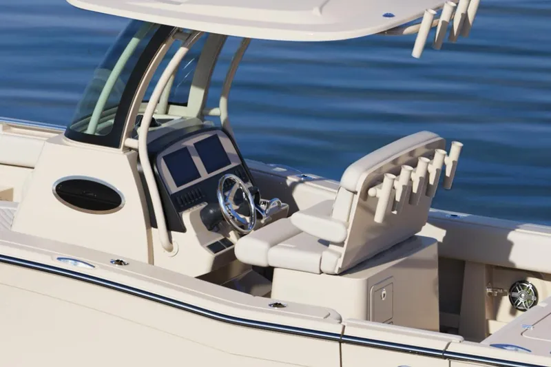 Slide: The Image of De afbeelding toont de cockpit van een Grady-White Canyon 266 boot met moderne bedieningselementen. - 5
