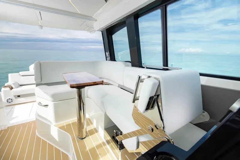 Slide: The Image of Manufacturer Provided Image: Luxurious interior of 2026 Tiara Yachts 39 LE with ocean view and elegant seating. - 13