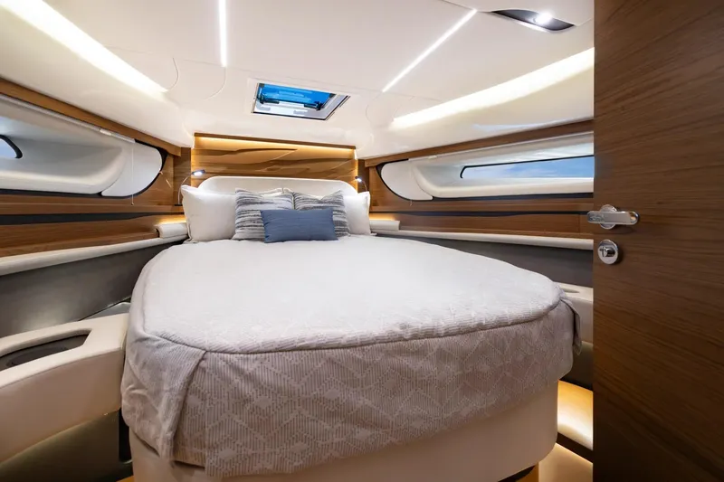 Slide: The Image of Manufacturer Provided Image: Luxurious cabin interior of 2026 Tiara Yachts 39 LE with elegant bedding and modern design. - 15