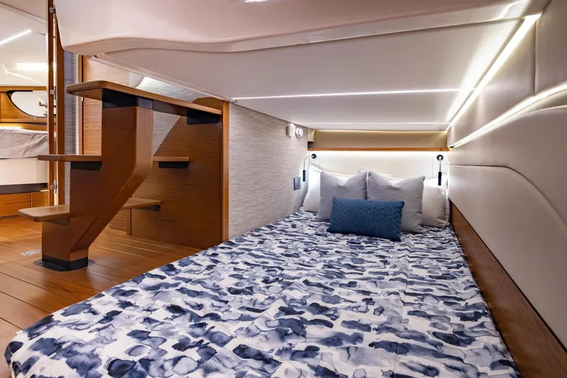 Slide: The Image of Manufacturer Provided Image: Luxurious cabin interior of 2026 Tiara Yachts 39 LE, featuring elegant bedding and modern lighting. - 17