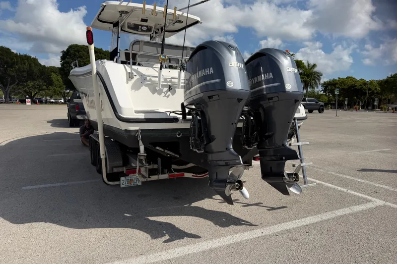 Slide: The Image of 2006 Century 3200 Center Console boat with twin Yamaha 300 engines on a trailer. - 8