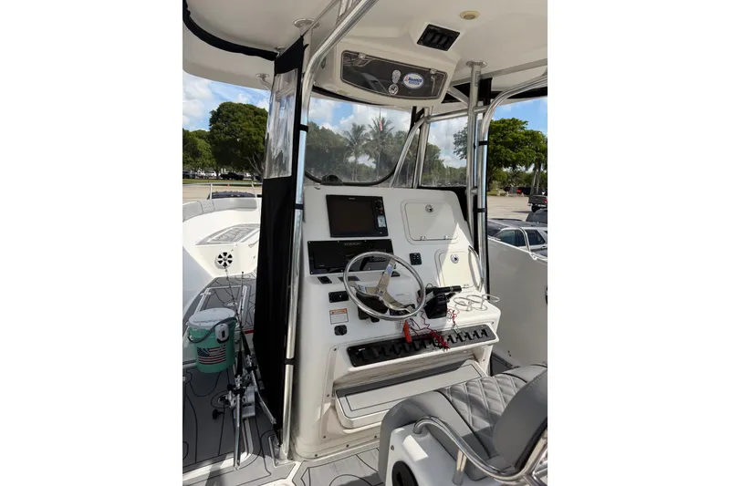 Slide: The Image of 2006 Century 3200 Center Console boat interior with steering wheel and control panel. - 5