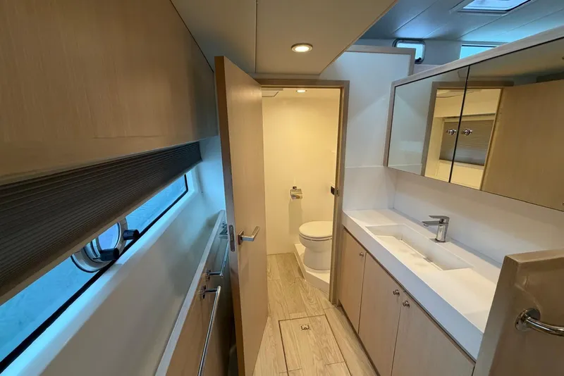 Slide: The Image of Modern bathroom interior in 2023 Longreach 58 Expedition yacht, featuring sleek design and ample storage. - 59