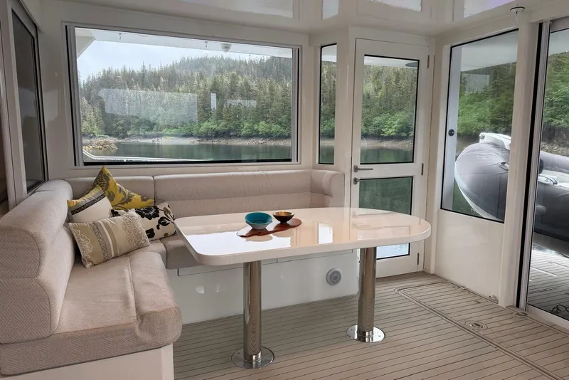 Slide: The Image of Luxurious interior of 2023 Longreach 58 Expedition yacht with scenic window views. - 31