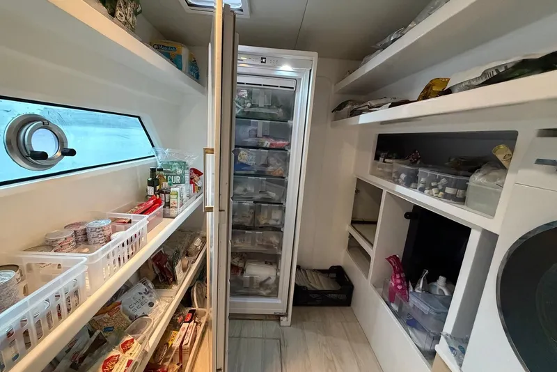 Slide: The Image of Pantry and storage area inside a 2023 Longreach 58 Expedition yacht. - 65