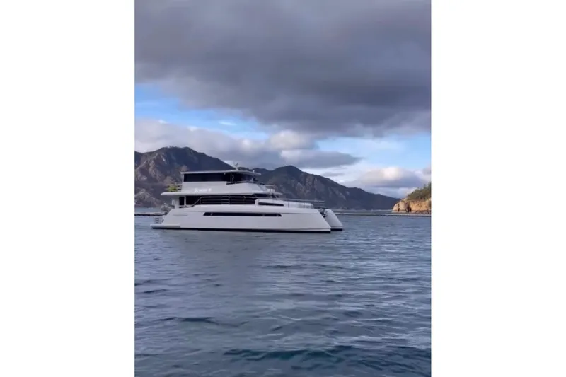 Slide: The Image of Luxury Longreach 58 yacht cruising on scenic waters, 2023 model. - 5