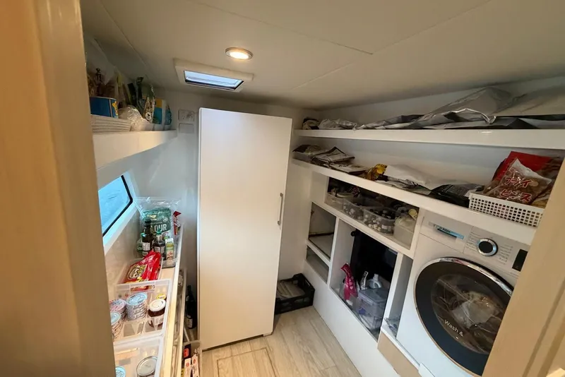 Slide: The Image of Laundry and storage area inside a 2023 Longreach 58 Expedition yacht. - 70