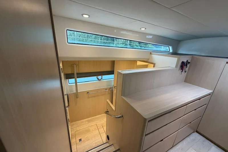 Slide: The Image of Interior of 2023 Longreach 58 Expedition yacht with modern wood cabinetry and sleek design. - 60