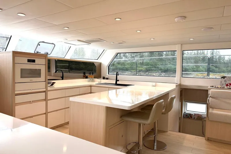 Slide: The Image of Modern kitchen interior of 2023 Longreach 58 Expedition yacht with sleek design and large windows. - 40