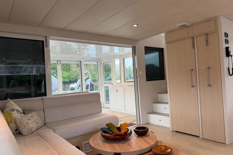Slide: The Image of Luxurious interior of 2023 Longreach 58 Expedition yacht with modern furnishings and large windows. - 36