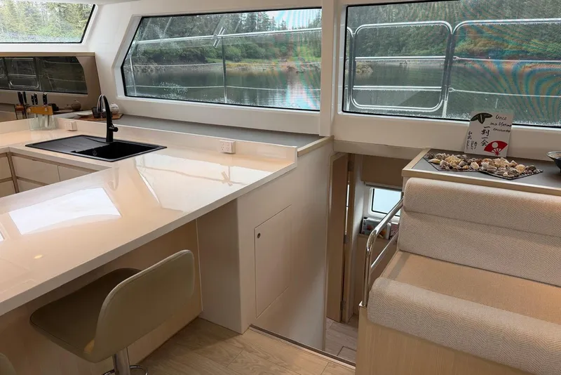 Slide: The Image of Luxurious interior of 2023 Longreach 58 Expedition yacht with modern kitchen and scenic windows. - 46
