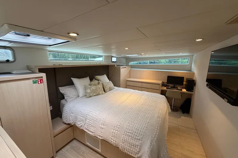 Slide: The Image of Luxurious bedroom interior of 2023 Longreach 58 Expedition yacht with modern amenities. - 58