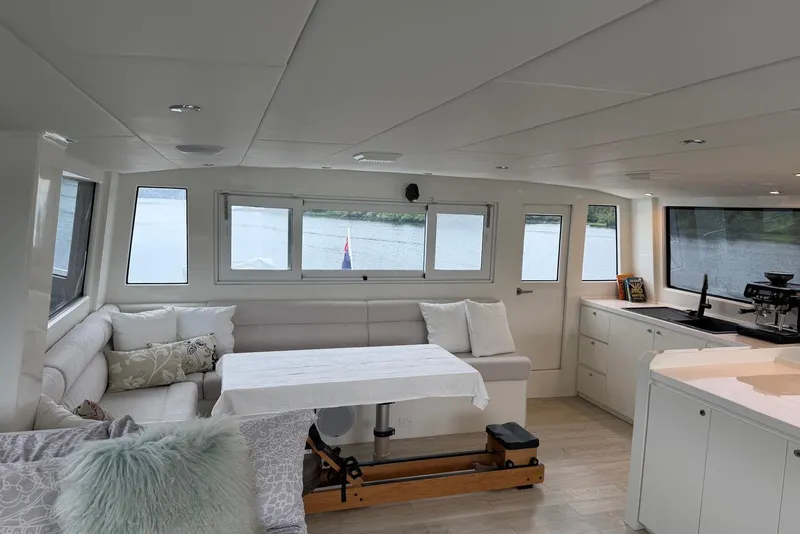 Slide: The Image of Luxurious interior of 2023 Longreach 58 Expedition yacht with modern seating and kitchen area. - 29