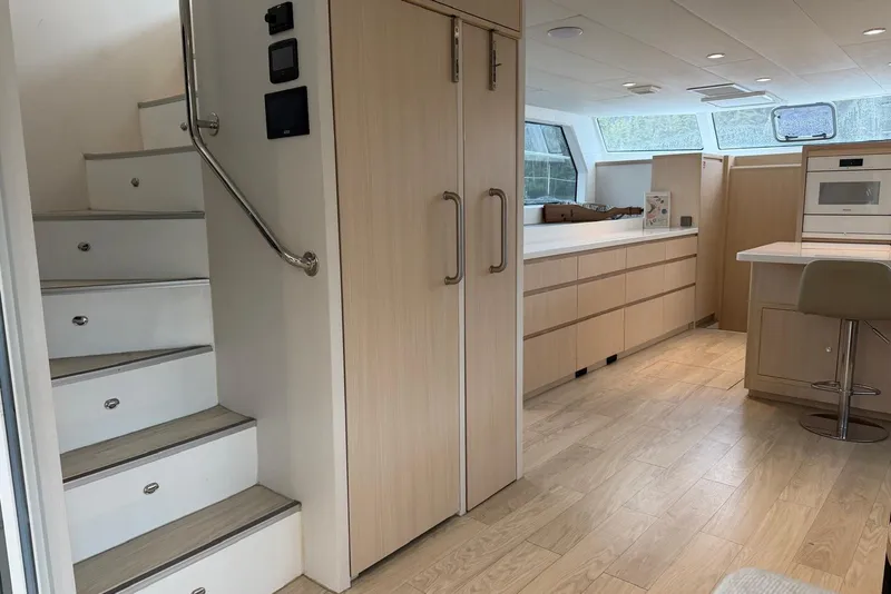 Slide: The Image of Modern interior of 2023 Longreach 58 Expedition yacht with sleek kitchen and staircase. - 51