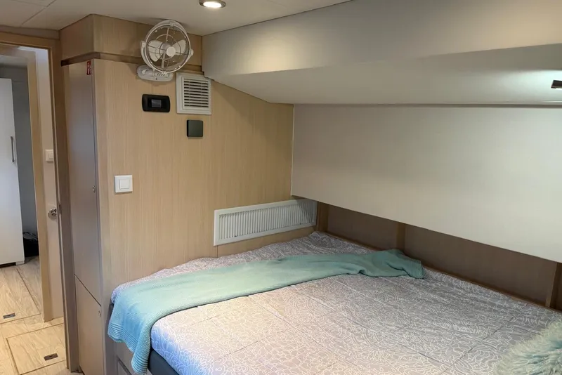 Slide: The Image of Cozy bedroom interior of 2023 Longreach 58 Expedition yacht with modern design elements. - 66