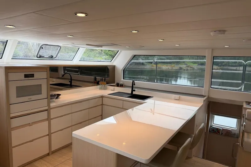 Slide: The Image of Luxurious kitchen interior of 2023 Longreach 58 Expedition yacht with modern appliances and scenic views. - 47