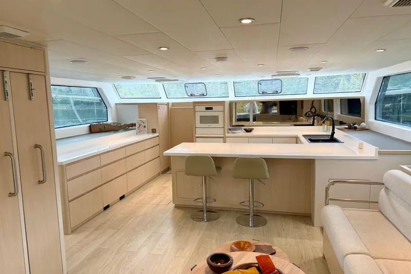Slide: The Image of Luxurious interior of 2023 Longreach 58 Expedition yacht with modern kitchen and seating area. - 37