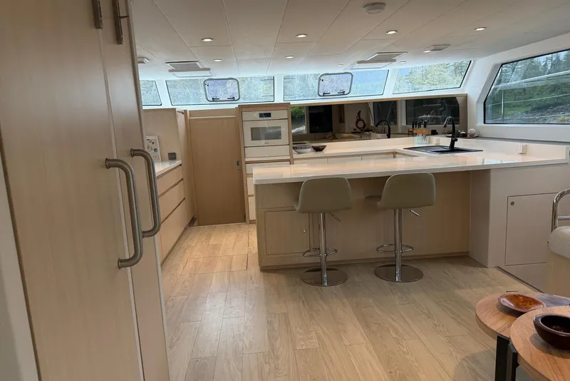 Slide: The Image of Modern kitchen interior on 2023 Longreach 58 Expedition yacht, featuring sleek design and ample natural light. - 39