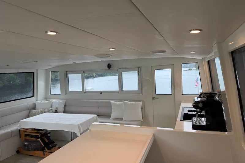 Slide: The Image of Interior of 2023 Longreach 58 Expedition yacht with modern seating and coffee machine. - 32