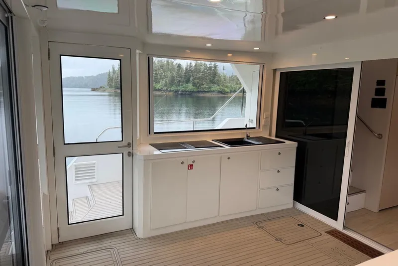 Slide: The Image of Interior of 2023 Longreach 58 Expedition yacht with modern kitchen and scenic water view. - 38