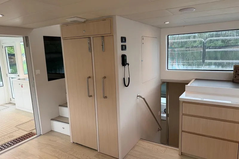 Slide: The Image of Modern interior of 2023 Longreach 58 Expedition yacht with wooden cabinetry and large window. - 53