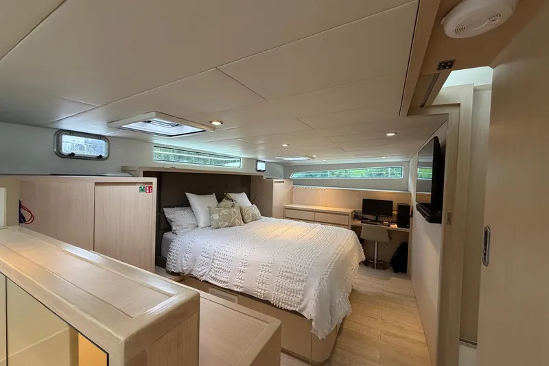 Slide: The Image of Luxurious bedroom interior of 2023 Longreach 58 Expedition yacht, featuring modern design and cozy ambiance. - 62
