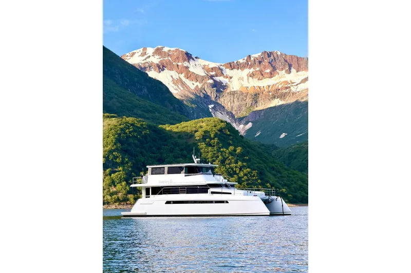 Slide: The Image of Luxury Longreach 58 yacht cruising in scenic mountain lake, 2023 model. - 3