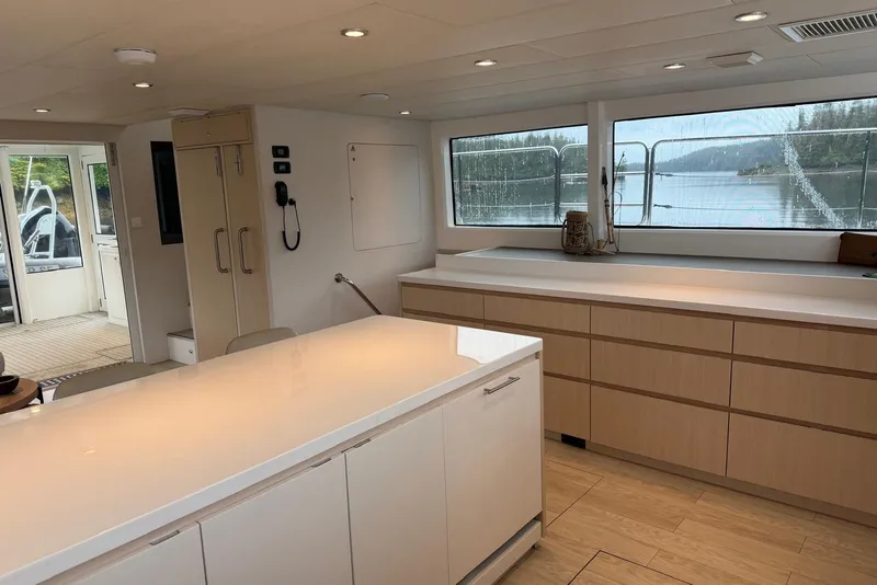 Slide: The Image of Modern kitchen interior of 2023 Longreach 58 Expedition yacht with scenic window view. - 50