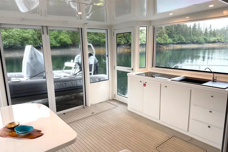 Slide: The Image of Luxurious interior of 2023 Longreach 58 Expedition yacht with scenic water view. - 18