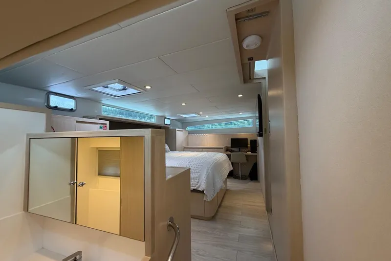 Slide: The Image of Luxurious interior of 2023 Longreach 58 Expedition yacht, featuring a cozy bedroom and modern amenities. - 57