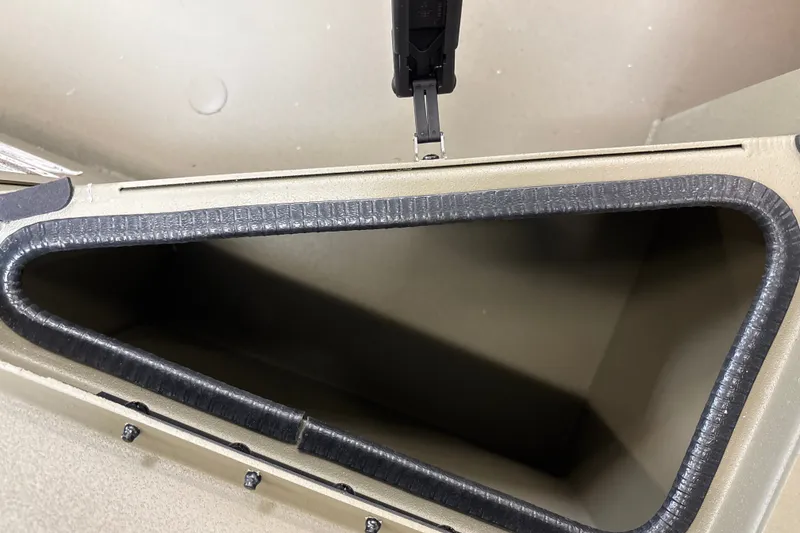 Slide: The Image of Open storage compartment of 2027 Tracker Grizzly 1756 T Marsh boat. - 16