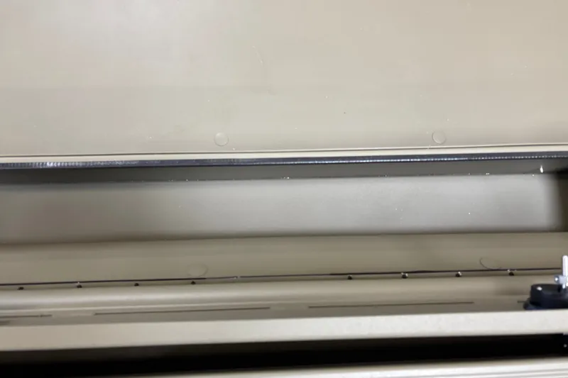 Slide: The Image of Interior view of a 2027 Tracker Grizzly 1756 T Marsh boat compartment. - 18