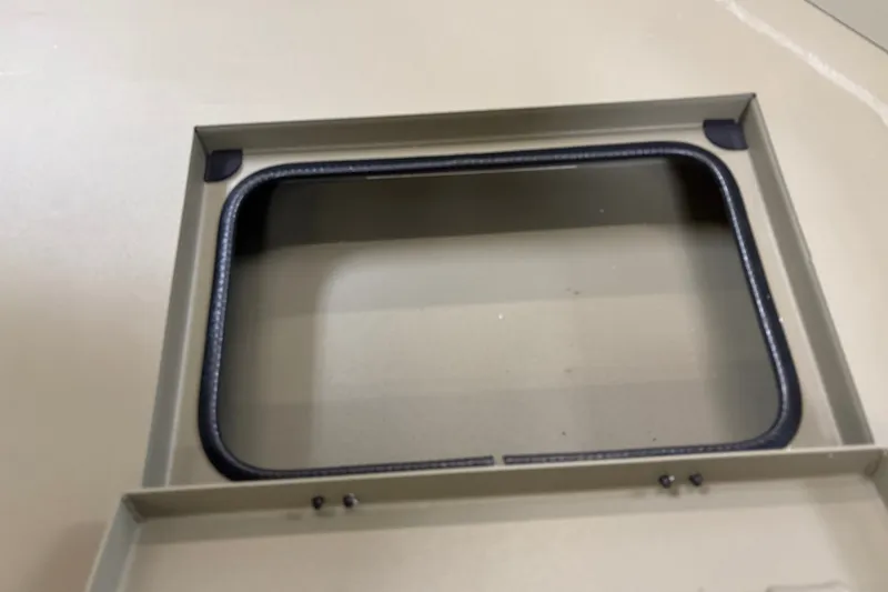 Slide: The Image of Rectangular opening in 2027 Tracker Grizzly 1756 T Marsh boat interior. - 14