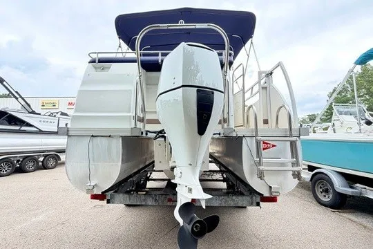 Slide: The Image of 2006 JC 23 Neptoon TT Triple Tube pontoon boat with outboard motor, rear view. - 22