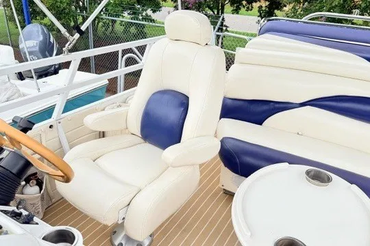 Slide: The Image of Luxury seating on 2006 JC 23 Neptoon TT boat with white and blue upholstery. - 17