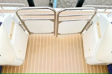 Slide: The Image of 2006 JC 23 Neptoon TT boat deck with seating and safety gate. - 6