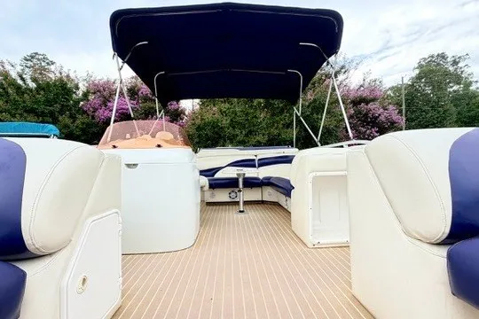 Slide: The Image of 2006 JC 23 Neptoon TT Triple Tube pontoon boat with canopy and seating. - 10
