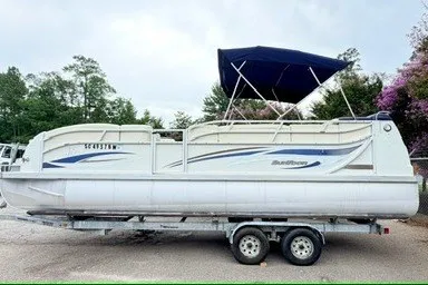 The Image of 2006 JC 23 Neptoon TT Triple Tube pontoon boat on trailer with canopy. - 1